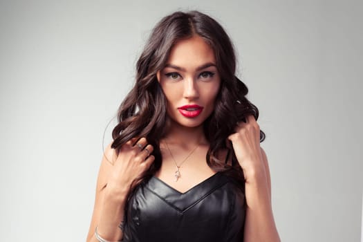 Asian model fashion girl portrait in black leather dress
