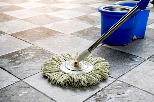 Clean tile floors with mops and floor cleaning products.