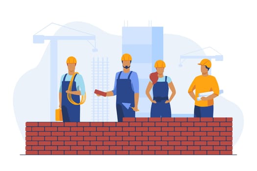 Professional builders making brick wall