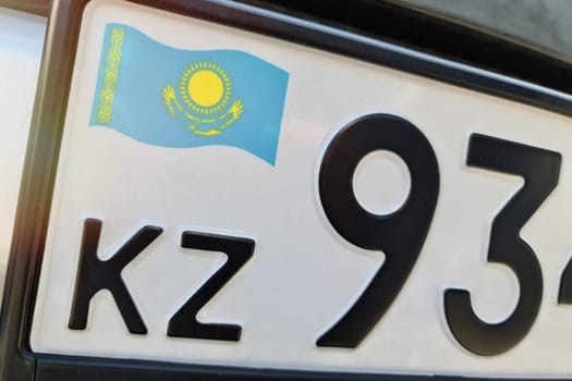 State car registration number close-up with the flag of Kazakhstan