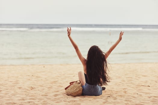 sea woman nature vacation attractive smile sitting beach sand freedom travel