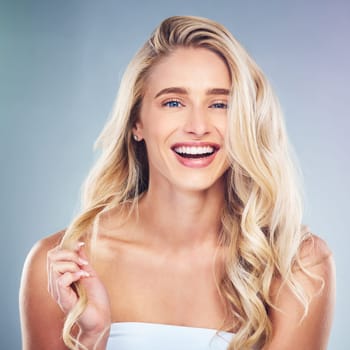 Woman, beauty and smile for natural hair cosmetic makeup and skincare treatment. Healthcare, skin health routine and luxury facial or body selfcare wellness model relax in grey background studio
