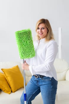 Cleaning woman holding a squeegee mop - house cleaning concept