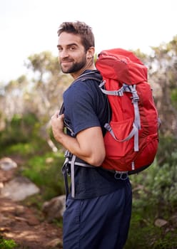 Hiking, walking and portrait of man on mountain for fitness, adventure and travel journey. Backpack, summer and workout with male hiker trekking in nature path for training, freedom and explore
