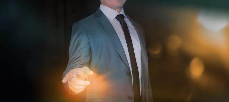Businessman pointing at something with his index finger.