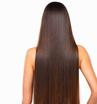 Long silky hair for days. Rearview studio shot of a young woman with long silky hair against a white background.