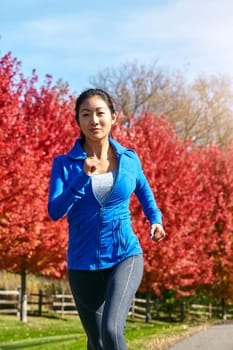 You become better as you start pushing yourself further. a sporty young woman running outdoors.