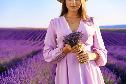 Close up photo of a woman in lilac dress in lavender field