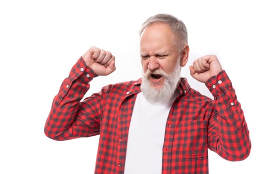joyful lucky 60s retired man with white beard and mustache in red shirt