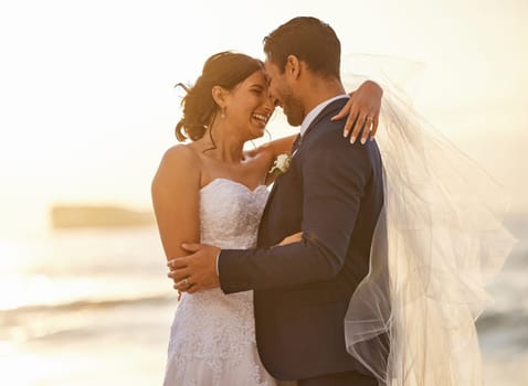Wedding, beach and couple hug at sunset for love, union and celebration against a nature background. Summer, marriage and happy groom with bride embracing at sea ceremony, smile and romantic in Miami.