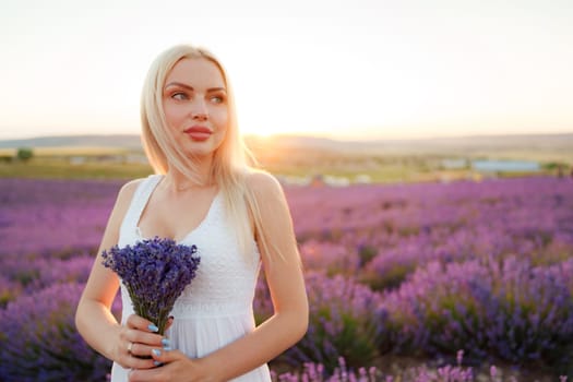 Blond haired girl standing in lavender field
