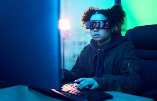 Computer hacker, cyberpunk and neon girl hacking software, online server or programming password phishing. Blue ransomware developer, cyber security glasses and night programmer coding malware code