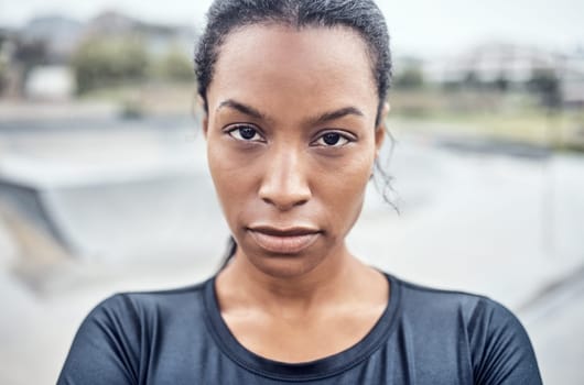Fitness, woman and serious portrait for exercise, cardio workout or training in the city outdoors. African American female face looking in confidence or determination for sports, goals or exercising