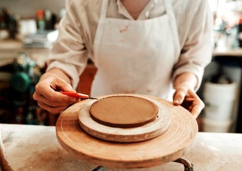 Its a skill that takes a lot of time to develop. an unrecognizable artisan working in a pottery workshop.