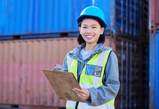 Logistics, cargo and a woman with inventory checklist on clipboard. Container yard, supply chain and happy shipping port employee from Japan. Smile, manager or inspector global freight company depot.