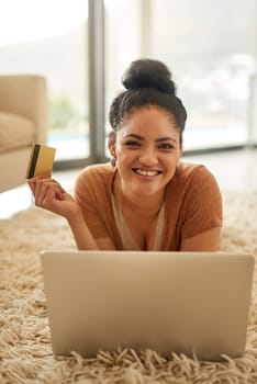 Woman with laptop, portrait with credit card and online shopping with payment on store website, fintech and smile. Female person at home, happy with internet banking and finance with e commerce