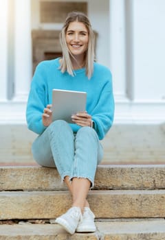 Woman, student and portrait smile with tablet relaxing on stairs for social media, browsing or research at campus. Happy female learner smiling in happiness for 5G streaming connection on touchscreen