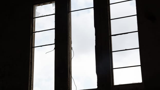 Broken window in an abandoned building