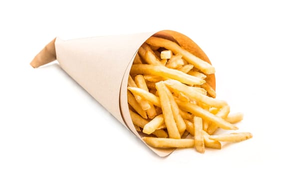 French fries wrapped in paper on white background