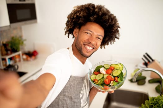 Black Cook Guy Taking Selfie Showing Prepared Meal In Kitchen