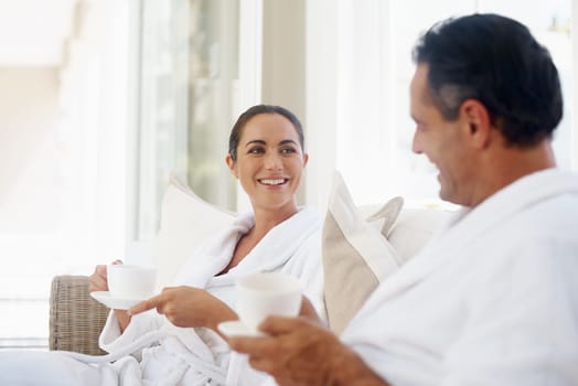 Happy, coffee and smile with couple at spa for luxury, vacation and romance. Breakfast, peace and morning with man and woman relax at hotel resort for wellness, celebration and holiday travel