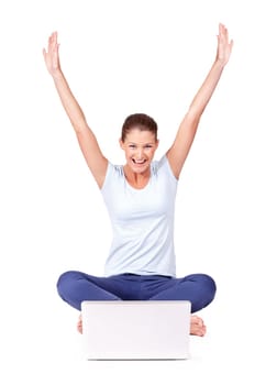 Celebrate, laptop and woman winner in a studio for online sports bet success or achievement. Happy, smile and portrait of a female person in celebration with a computer isolated by a white background