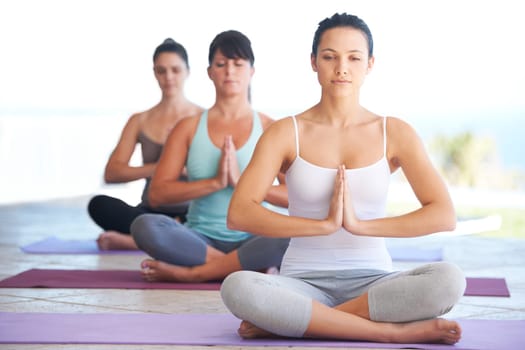 Peace, meditation class and woman with zen and yoga exercise outdoor with a pilates instructor. Spiritual, namaste and wellness of training, workout and fitness group feeling calm from meditating