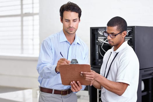 Server room, it support and contract with a technician talking to a business man about cyber security. Network, database and clipboard signature with an engineer chatting about a deal or agreement
