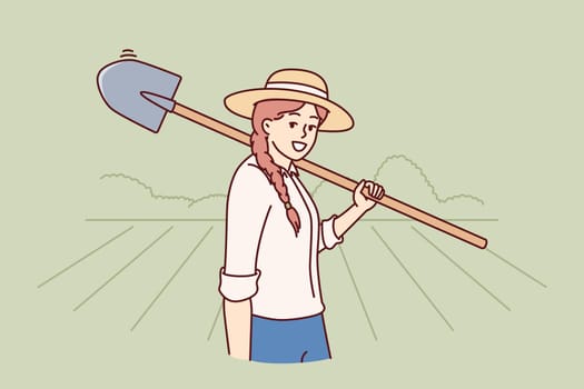 Woman farmer holding shovel to prepare land for planting seeds or digging up crop