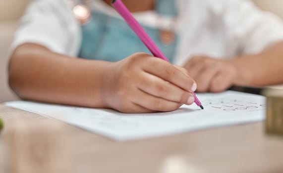 Child, drawing or hands writing on paper in kindergarten education for knowledge development at school desk. Kid, creative or young student with color pencil learning or working on sketching skills