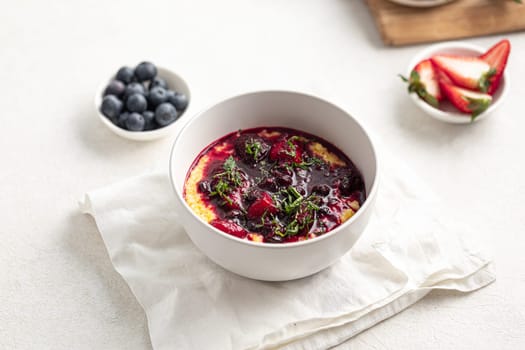 Portion of gourmet breakfast porridge with berries