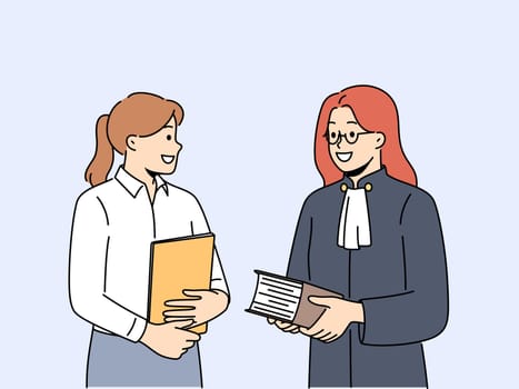 Female lawyer and paralegal in office