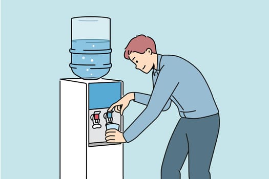 Man pouring water from cooler in office