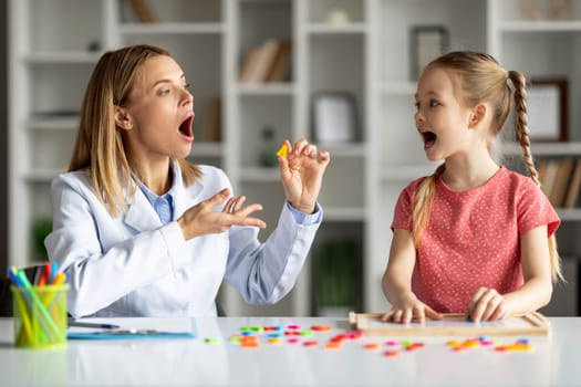 Effective Speech Therapy. Therapist Lady Having Lesson With Cute Little Girl
