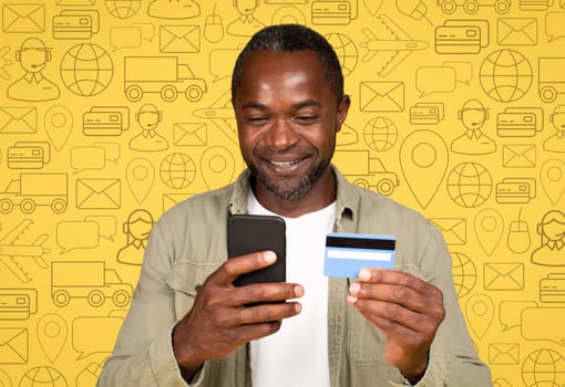 Smiling black man with phone and bank card, online banking