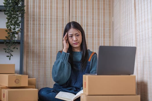 Small Business, Startup SME, Owner Entrepreneurs. Asian woman with unsuccess business online shopping crying and serious face unhappy mood.