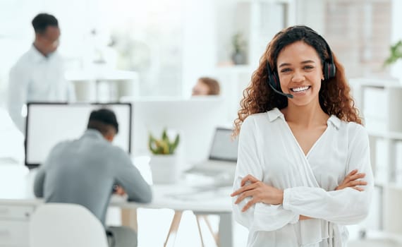 Call center woman, confident portrait and office with arms crossed, leader and pride with team in blurred background. Telemarketing manager, happy and smile for customer service, tech support or crm