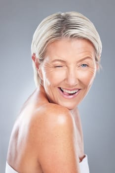 Wink, funny and senior beauty woman face happy about skincare and wellness. Portrait of an elderly model from Scandinavia with happiness of dermatology, skin health and anti aging treatment