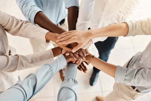 Hands, team with support and solidarity, diversity with business people, collaboration and trust in the workplace. Community, team building and working together, office teamwork and partnership.