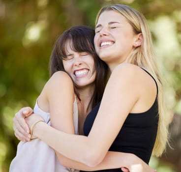 Love, friends and women hug in nature, bonding and laughing together outdoors. Support smile, care and happy girls embrace, hugging or cuddle for affection, trust and friendship in park on vacation.