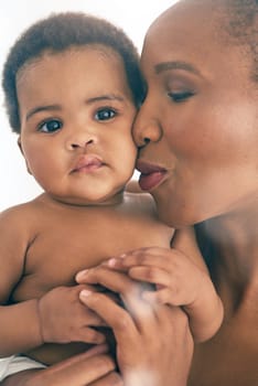 Black woman with baby, face and hug with family, content and bonding with love and early childhood and happiness. African female, mother holding child with parenting, motherhood and cuddle with care