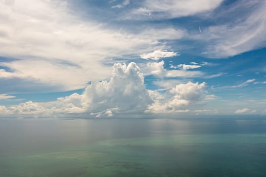 Aerial view of Blue sky with clouds over sea.