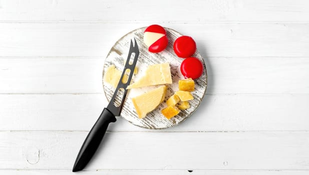 Italian cheese parmesan on plate with knife