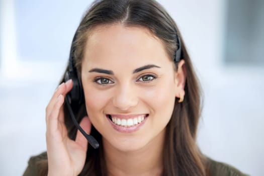 Happy woman in portrait, call center and contact us with communication and CRM with tech support. Customer service, help desk and telemarketing with female consultant and smile on face with telecom