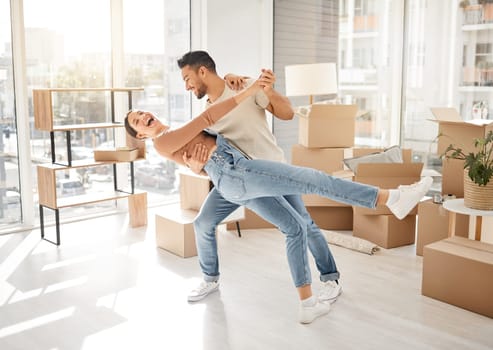 Celebration, dance and couple with boxes, property and excited with rent apartment, mortgage and home. Cardboard, man and woman dancing, real estate and moving with love, quality time and romance.