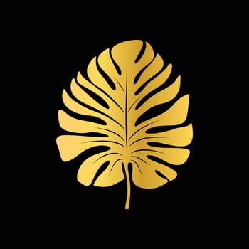 Gold tropical Monstera leaf, isolated on black background