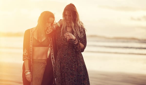 Dont trade your authenticity for approval. two young women spending the day at the beach at sunset.