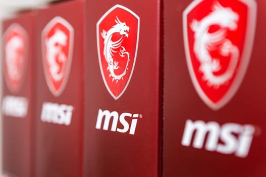 Kyiv, Ukraine - 27 January 2022: Motherboard and graphics card boxes lined up with MSI dragon logo. MSI is a Taiwanese multinational information technology headquartered in New Taipei City, Taiwan.