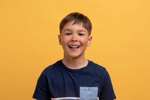 Photo portrait of cute little boy with toothy beaming smile