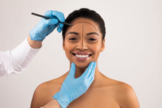 Happy pretty african american woman have plastic surgery session